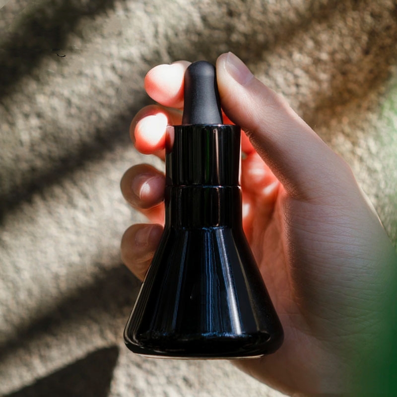 Embalagem cosmética de vidro cônico preto para garrafa de óleo essencial Embalagem cosmética de vidro cônico preto para garrafa de óleo essencial