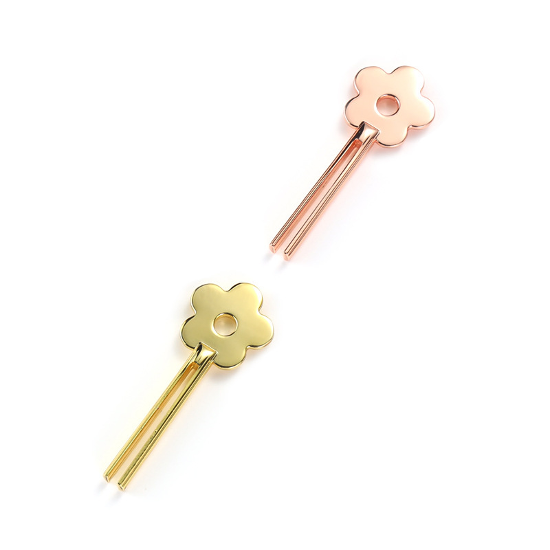 Espremedor de tubos de liga de zinco em forma de flor sorridente Espremedor de tubos de liga de zinco em forma de flor sorridente